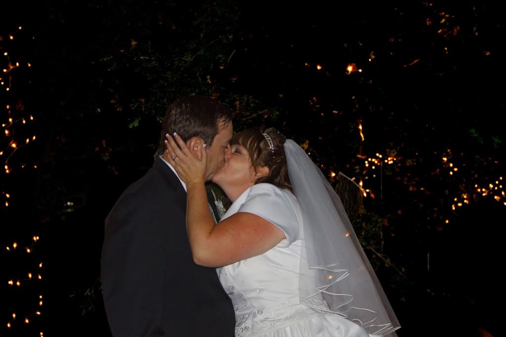 IMAGE: http://i1103.photobucket.com/albums/g463/Roc34ky/Goodheart%20Wedding%20October%202011/AnotherWeddingKiss.jpg